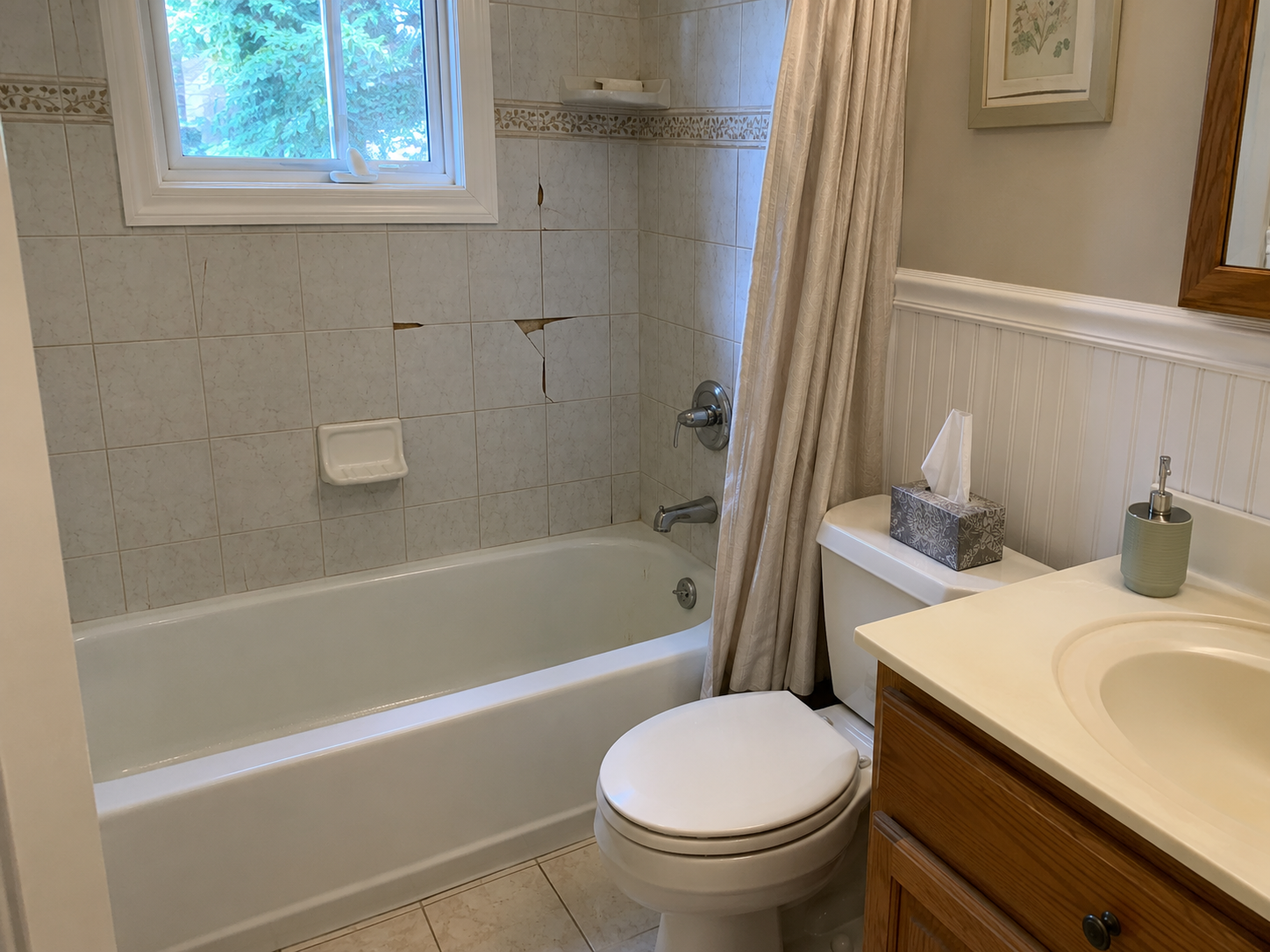 Bathroom before tile repair with cracked shower wall tiles in Mount Laurel